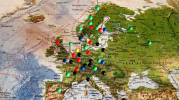 Europakarte zu sehen und einige Länder sind mit Stecknadeln markiert