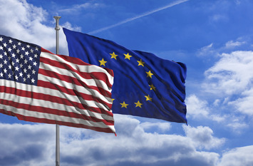 USA and European Union waving flags on blue sky background