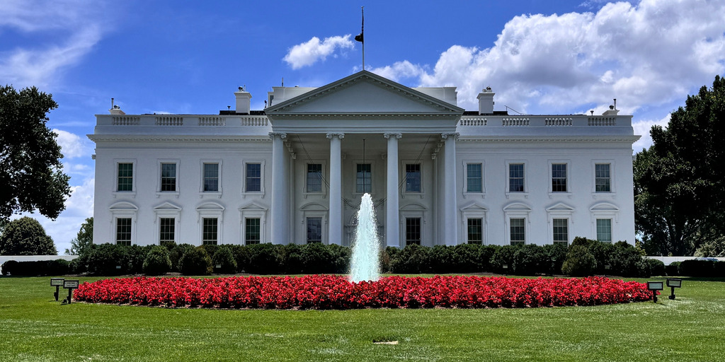 The White House in June 20, 2024. Photo taken from Lafayette Square facing towards the northern façade of the White House, with the North Lawn and the North Lawn fountain visible.