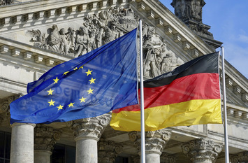 German Parliament Building with German and European Flags
